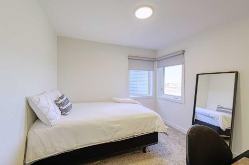 25 Belmont Green Sw, Calgary, AB - Indoor Photo Showing Bedroom