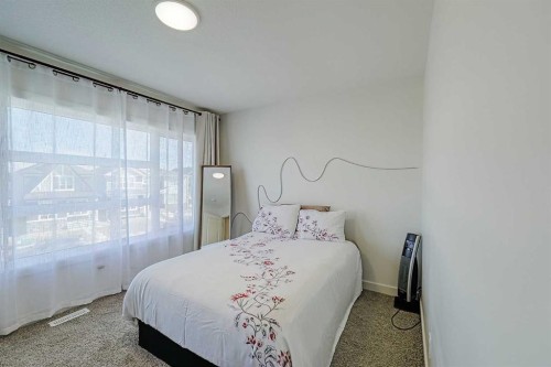 25 Belmont Green Sw, Calgary, AB - Indoor Photo Showing Bedroom