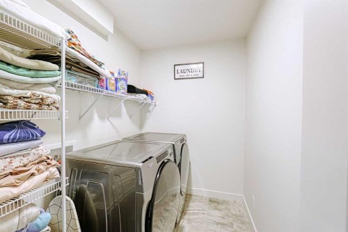 25 Belmont Green Sw, Calgary, AB - Indoor Photo Showing Laundry Room