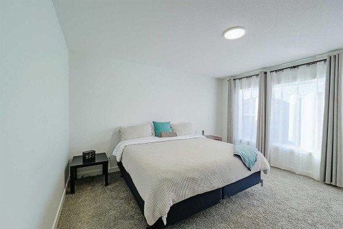 25 Belmont Green Sw, Calgary, AB - Indoor Photo Showing Bedroom
