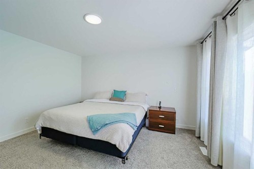 25 Belmont Green Sw, Calgary, AB - Indoor Photo Showing Bedroom