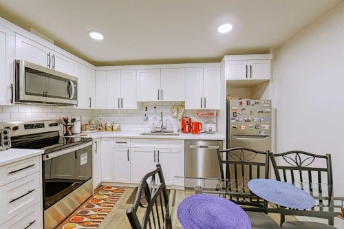 25 Belmont Green Sw, Calgary, AB - Indoor Photo Showing Kitchen With Stainless Steel Kitchen