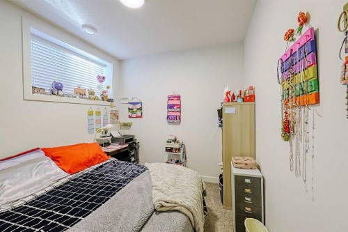 25 Belmont Green Sw, Calgary, AB - Indoor Photo Showing Bedroom