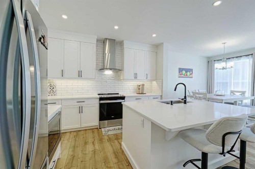 25 Belmont Green Sw, Calgary, AB - Indoor Photo Showing Kitchen With Stainless Steel Kitchen With Upgraded Kitchen