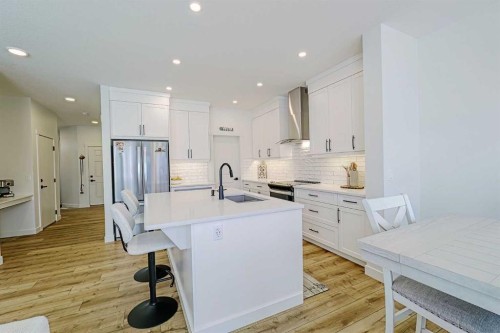 25 Belmont Green Sw, Calgary, AB - Indoor Photo Showing Kitchen With Stainless Steel Kitchen With Upgraded Kitchen