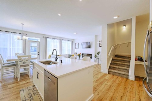 25 Belmont Green Sw, Calgary, AB - Indoor Photo Showing Kitchen With Double Sink With Upgraded Kitchen