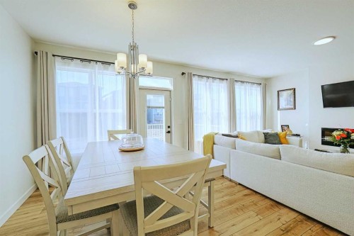 25 Belmont Green Sw, Calgary, AB - Indoor Photo Showing Other Room With Fireplace