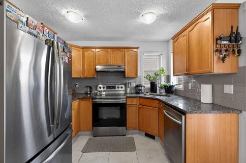 14 Hidden Ranch Hill Nw, Calgary, AB - Indoor Photo Showing Kitchen With Stainless Steel Kitchen With Double Sink