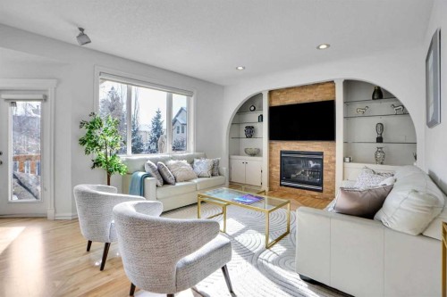 6 Strathridge Way Sw, Calgary, AB - Indoor Photo Showing Living Room With Fireplace