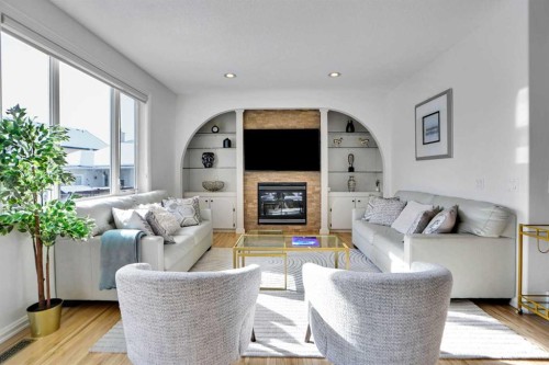 6 Strathridge Way Sw, Calgary, AB - Indoor Photo Showing Living Room With Fireplace