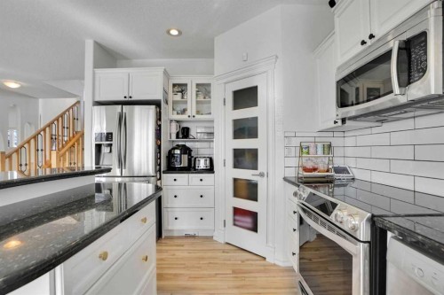 6 Strathridge Way Sw, Calgary, AB - Indoor Photo Showing Kitchen With Upgraded Kitchen