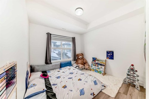 44 Spring Creek Common Sw, Calgary, AB - Indoor Photo Showing Bedroom