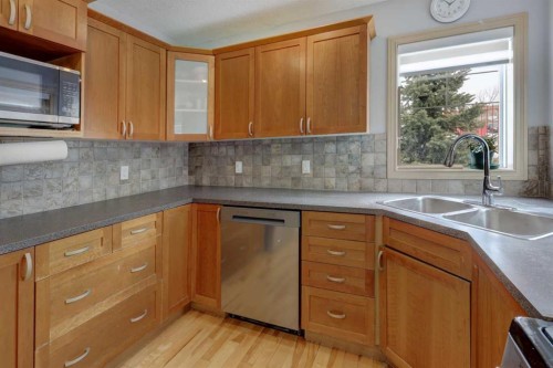 115 Rockledge Terrace Nw, Calgary, AB - Indoor Photo Showing Kitchen With Double Sink