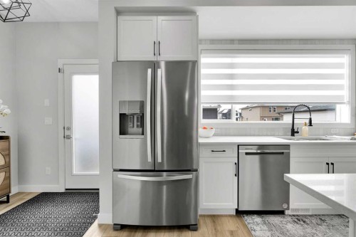 125 Emberside Hollow, Cochrane, AB - Indoor Photo Showing Kitchen With Stainless Steel Kitchen