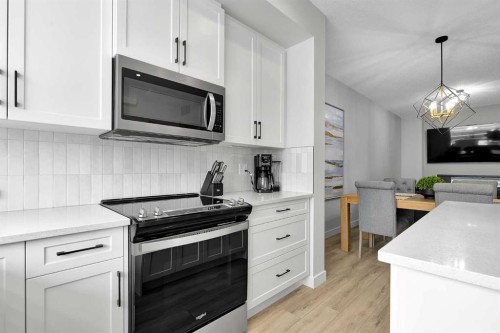 125 Emberside Hollow, Cochrane, AB - Indoor Photo Showing Kitchen