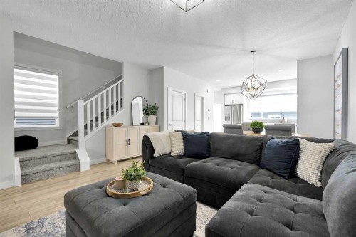 125 Emberside Hollow, Cochrane, AB - Indoor Photo Showing Living Room