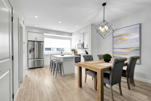 125 Emberside Hollow, Cochrane, AB - Indoor Photo Showing Dining Room