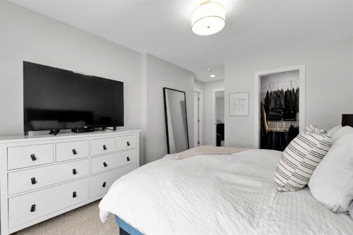 125 Emberside Hollow, Cochrane, AB - Indoor Photo Showing Bedroom