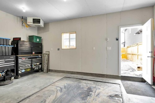 125 Emberside Hollow, Cochrane, AB - Indoor Photo Showing Garage