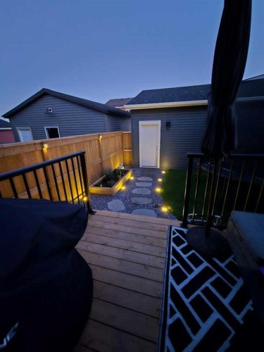 125 Emberside Hollow, Cochrane, AB - Outdoor With Deck Patio Veranda With Exterior