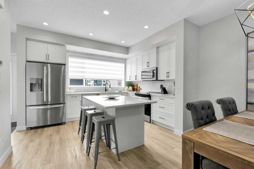 125 Emberside Hollow, Cochrane, AB - Indoor Photo Showing Kitchen With Stainless Steel Kitchen