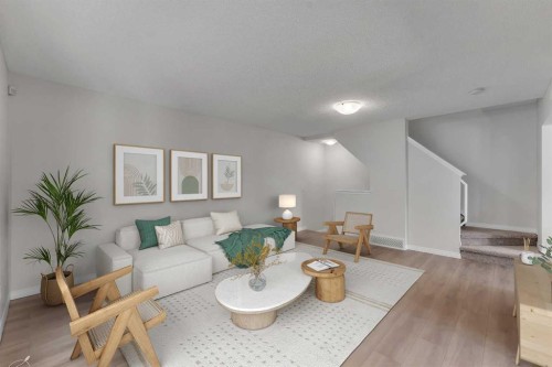 165 Windstone Avenue Sw, Airdrie, AB - Indoor Photo Showing Living Room