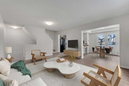 165 Windstone Avenue Sw, Airdrie, AB - Indoor Photo Showing Living Room