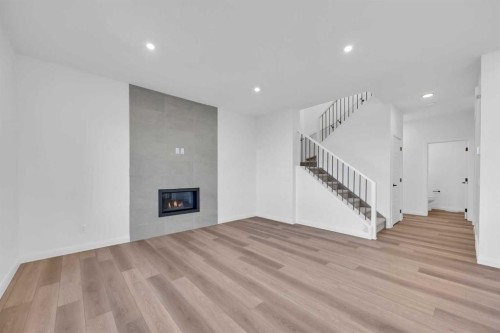 154 Northern Lights Crescent, Langdon, AB - Indoor With Fireplace