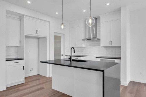 154 Northern Lights Crescent, Langdon, AB - Indoor Photo Showing Kitchen With Upgraded Kitchen