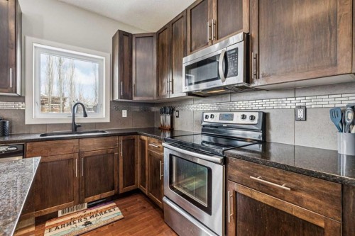 4 Drake Landing Gate, Okotoks, AB - Indoor Photo Showing Kitchen With Stainless Steel Kitchen