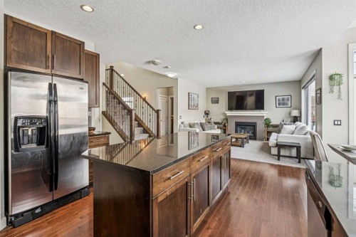 4 Drake Landing Gate, Okotoks, AB - Indoor With Fireplace
