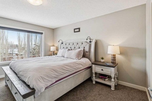 4 Drake Landing Gate, Okotoks, AB - Indoor Photo Showing Bedroom
