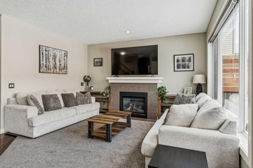 4 Drake Landing Gate, Okotoks, AB - Indoor Photo Showing Living Room With Fireplace