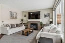 4 Drake Landing Gate, Okotoks, AB  - Indoor Photo Showing Living Room With Fireplace 