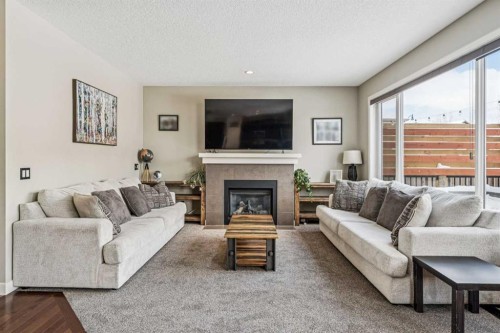 4 Drake Landing Gate, Okotoks, AB - Indoor Photo Showing Living Room With Fireplace