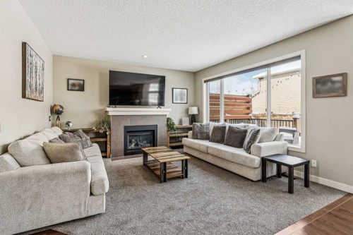 4 Drake Landing Gate, Okotoks, AB - Indoor Photo Showing Living Room With Fireplace