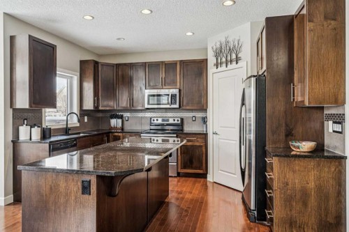 4 Drake Landing Gate, Okotoks, AB - Indoor Photo Showing Kitchen With Stainless Steel Kitchen With Double Sink With Upgraded Kitchen