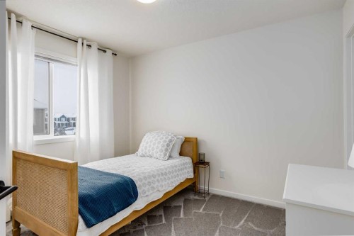 237 South Point Park Sw, Airdrie, AB - Indoor Photo Showing Bedroom