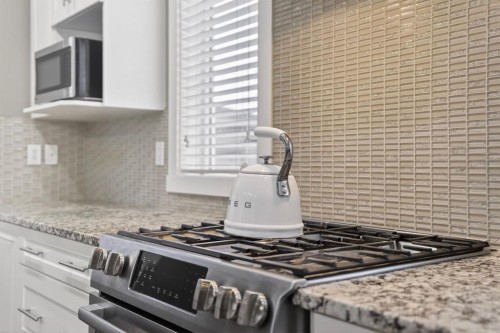 229 Rainbow Falls Glen, Chestermere, AB - Indoor Photo Showing Kitchen With Upgraded Kitchen