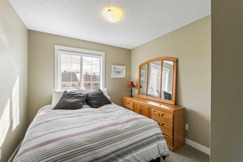 115 Baysprings Terrace Sw, Airdrie, AB - Indoor Photo Showing Bedroom