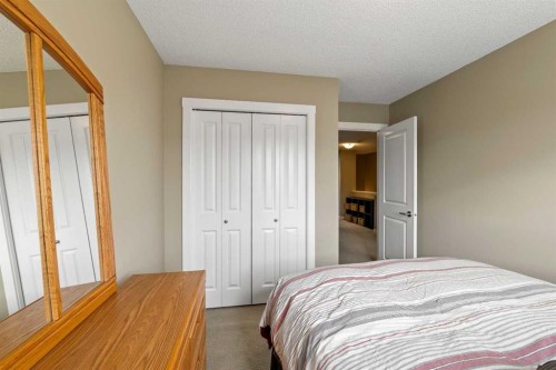 115 Baysprings Terrace Sw, Airdrie, AB - Indoor Photo Showing Bedroom