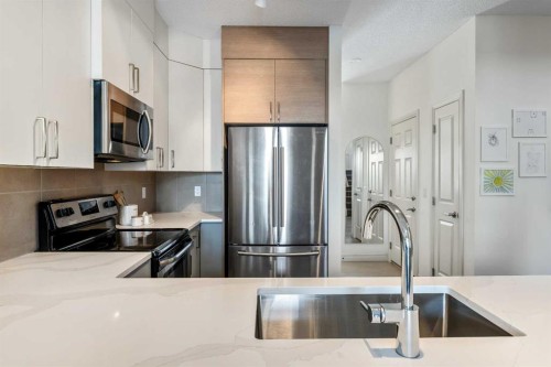 522 River Heights Crescent, Cochrane, AB - Indoor Photo Showing Kitchen With Double Sink With Upgraded Kitchen