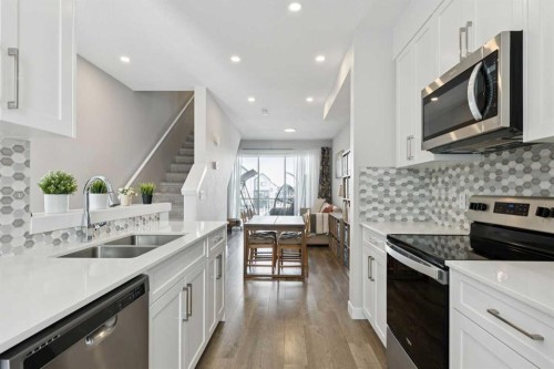 579 Evanston Link, Calgary, AB - Indoor Photo Showing Kitchen With Stainless Steel Kitchen With Double Sink With Upgraded Kitchen