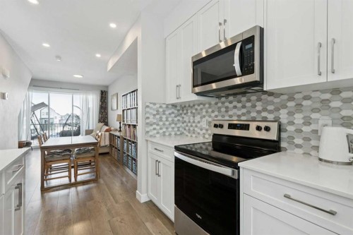579 Evanston Link, Calgary, AB - Indoor Photo Showing Kitchen With Upgraded Kitchen