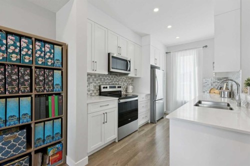 579 Evanston Link, Calgary, AB - Indoor Photo Showing Kitchen With Stainless Steel Kitchen With Double Sink With Upgraded Kitchen