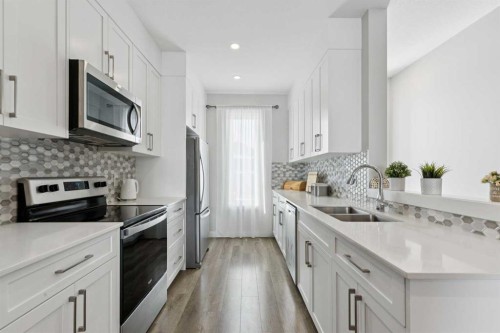 579 Evanston Link, Calgary, AB - Indoor Photo Showing Kitchen With Stainless Steel Kitchen With Double Sink With Upgraded Kitchen