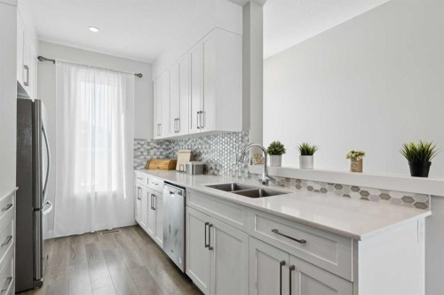 579 Evanston Link, Calgary, AB - Indoor Photo Showing Kitchen With Double Sink