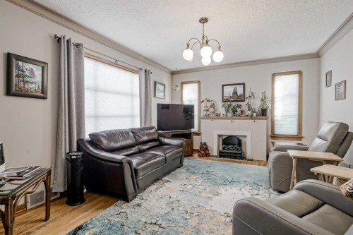 1411 20 Avenue Nw, Calgary, AB - Indoor Photo Showing Living Room With Fireplace