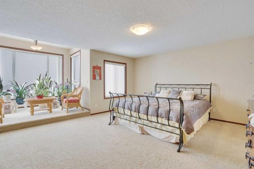 160 Tremblant Way Sw, Calgary, AB - Indoor Photo Showing Bedroom