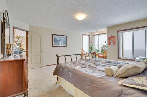 160 Tremblant Way Sw, Calgary, AB - Indoor Photo Showing Bedroom